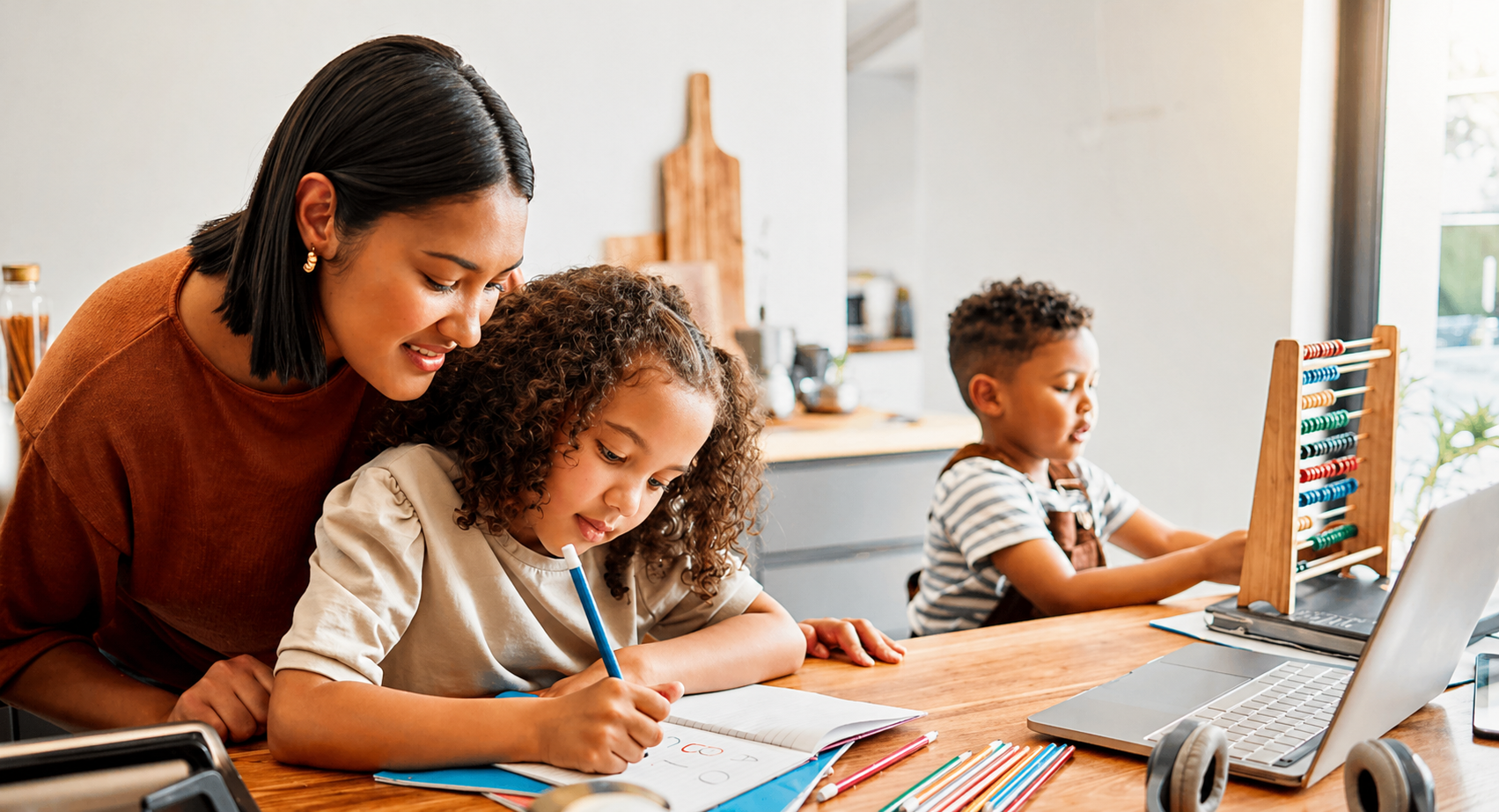 Parent helping a young child practise early English at home